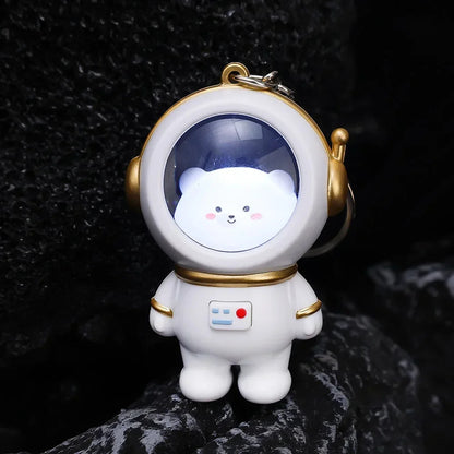 Portachiavi luminoso astronauta con orsetto o gattino kawaii, perfetto per chiavi e borse. Un accessorio che si illumina al buio, ideale per gli amanti dello spazio e del kawaii.