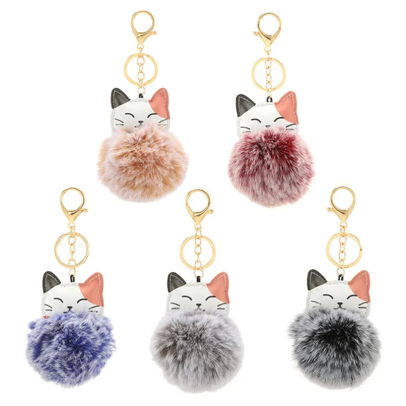 Portachiavi con pompom morbido in pelliccia sintetica e design a forma di gatto, perfetto per accessori e chiavi.